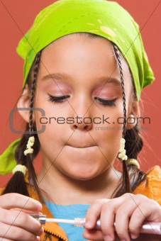 child applying make-up