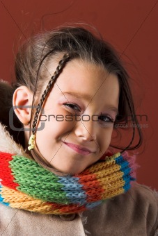 child with coat and scarf