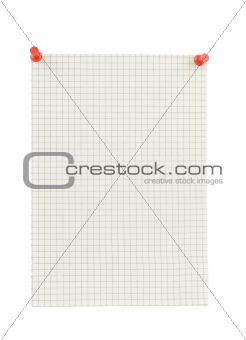 piece of squared paper thumbthacked to white wall 