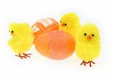 three toy chickens with decorated eggs