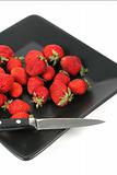 strawberries on Black Plate over White 