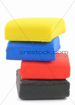 pile of colorful plasticine blocks on white