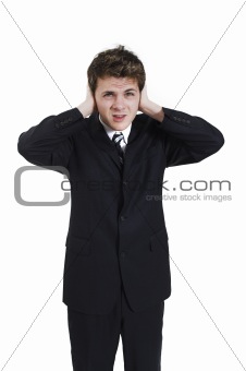 man plugging his ears