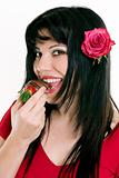 Female eating fresh strawberries in chocolate