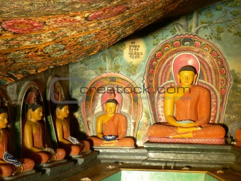Statues of Lord Buddha & paintings in an ancient temple