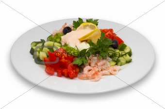 shrimp salad with fresh vegetables, lemon and olives