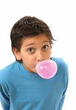 Boy blowing a pink bubble gum