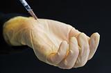 Glove and syringe