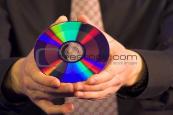 business hand holding CD