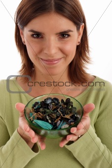 Young woman holding a bowl with potpourri