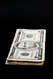 Stack of dollar bills, isolated on black background