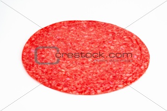 Salami slice closeup isolated