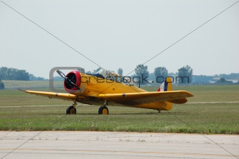 Vintage yellow airplane on ground
