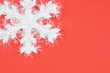 White snowflake on red background