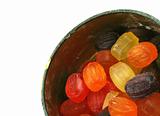 colorful fruit drops in a metal box - isolated