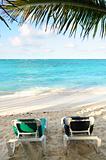 Beach chairs on ocean shore