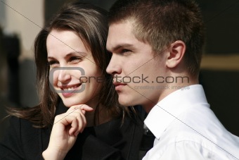 woman smiling and man looking far away