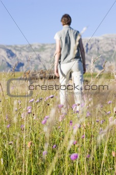 Woman in a mountain meadow