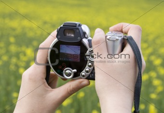 Woman hans holding camera