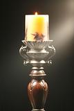 Antique wooden candlestick with ray of light