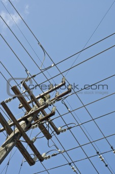grid of power lines on pole