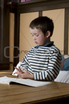 1st grade boy doing homework