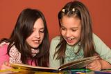 girls reading book