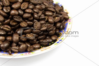 Coffe beans with plate isolated on white