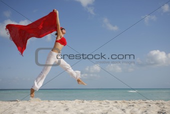 Woman jumping on the Beach