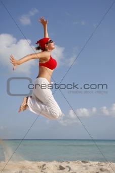 Woman jumping on the Beach