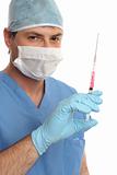 Surgeon haematologist  in scrubs with syringe needle