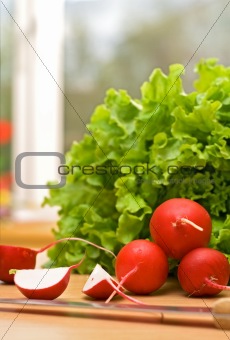 Radish and lettuce on the kitchen table