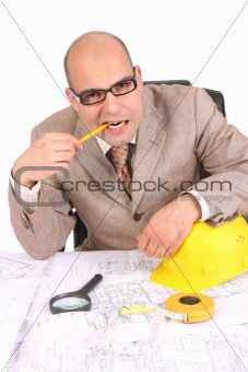 Businessman thinking with architectural plans