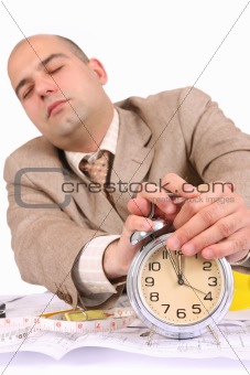 A businessman sleepy with architectural plans