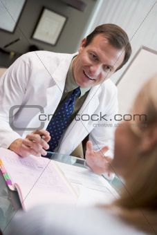 Doctor in consultation with female patient