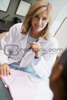 Doctor in discussion with patient in IVF clinic
