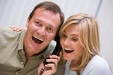 Couple receiving good news over the phone