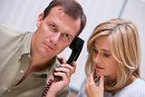 Couple receiving bad news over phone