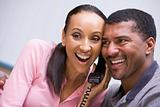 Couple receiving good news over phone