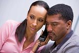 Couple listening to news over phone