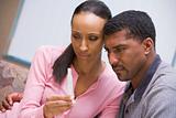 Couple looking at home pregnancy test