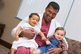 Consultant holding two IVF children