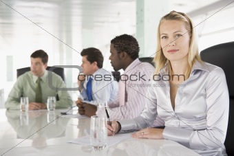 Four businesspeople having meeting in boardroom