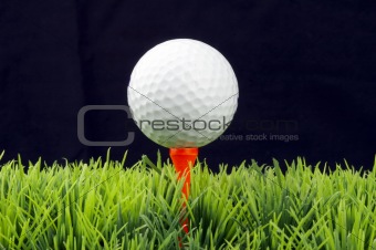 Golfball on red tee  