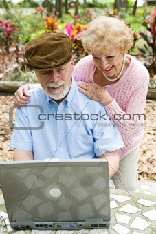 Senior Couple on Computer - Vertical
