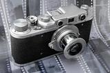 Vintage rangefinder camera over black and white film