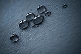 water drops over black leather