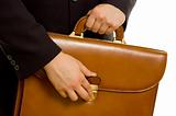 Businessman is opening his briefcase
