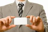 Business card in businessman's hands