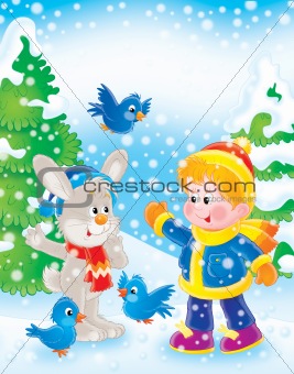 Boy, rabbit and birds in winter forest